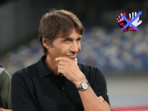 Antonio Conte pensieroso e dei guanti da portiere